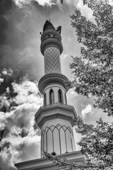 Obraz premium Exterior view Masjid Raya Hubbul Wathan largest mosque Lombok modern Islamic architecture colorful towers city skyline backdrop