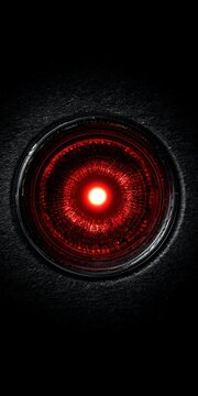 Close up of a futuristic glowing eye with a red iris against a black background