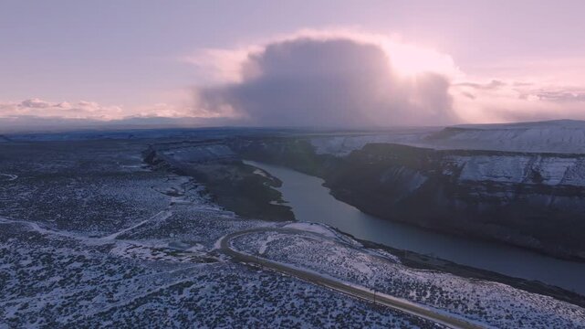 Aerial view of Snake River canyon in the Morley Nelson Snake River Birds of Prey National Conservation Area with snowy terrain in Murphy, Idaho, United States.