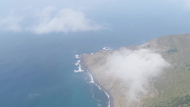 Aerial footage showing the rugged cliffs and dramatic coastline around Garita da Herbeira near Meizoso, Spain. The natural scenery highlights the wild beauty of this coastal region in Galicia.