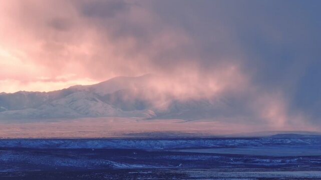 Aerial view of Morley Nelson Snake River Birds of Prey National Conservation Area with dramatic clouds and sunset light over the vast landscape in Murphy, Idaho, United States.