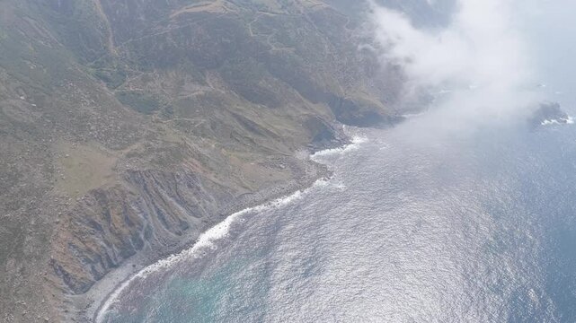 Aerial footage captures the dramatic, rocky coastline near Garita da Herbeira in Meizoso, Spain. No people are visible in the scene.