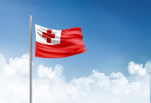 Tonga flag waving in beautiful sky.