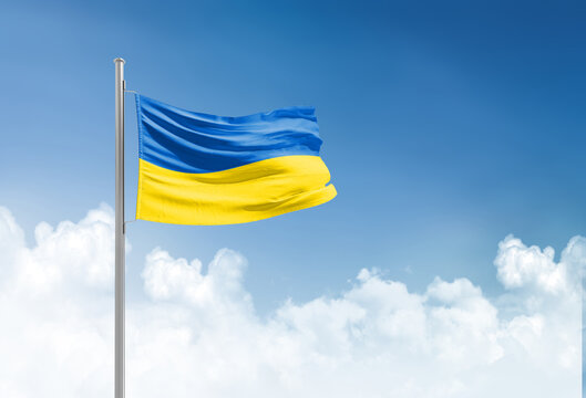 Ukraine flag waving in beautiful sky.