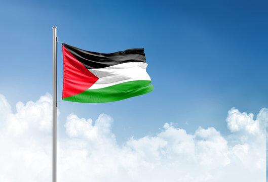 Palestine flag waving in beautiful sky.