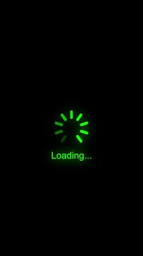 Glowing green loading spinner animation on black background, for digital interface, and web progress indicators