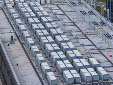 Aerial view of rows of industrial cooling units and HVAC equipment installed on a large flat rooftop in Drogheda, County Louth, Ireland.