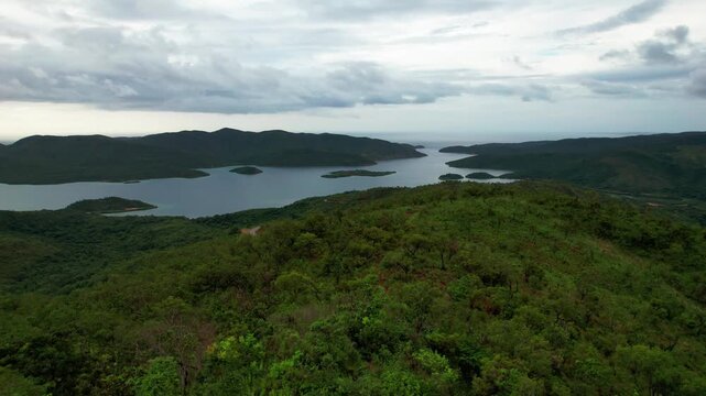 Drone Aerial View Flying Forward Over Lush Green Mountains and Coastal Bay of Mochima National Park, Venezuela.