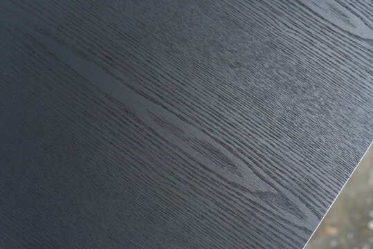 Close up of dark wood grain.