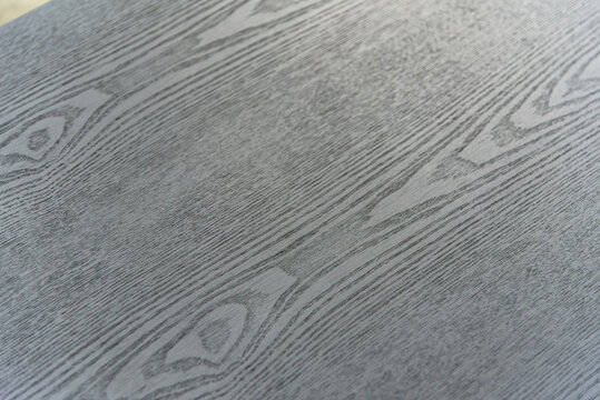 Close up of dark wood grain.