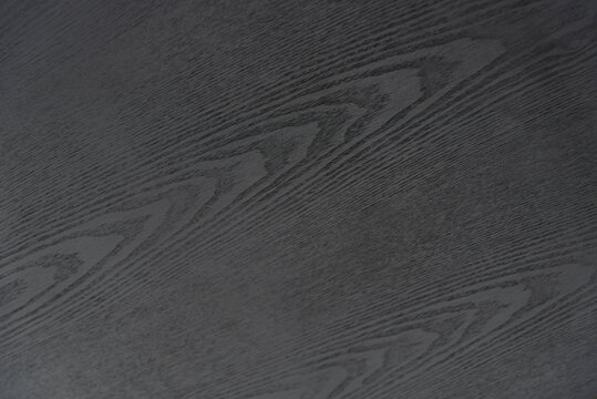 Close up of dark wood grain.