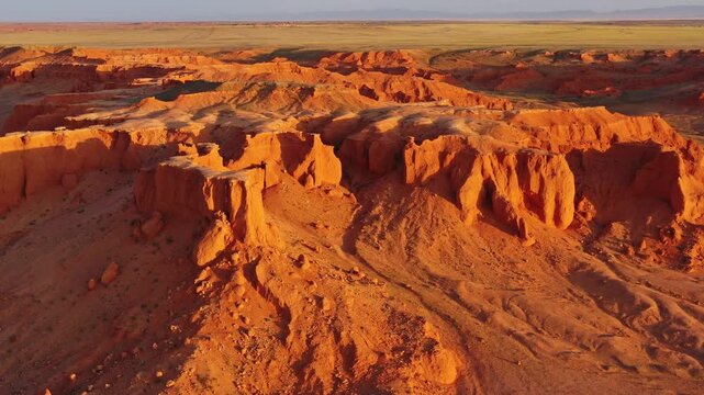 Aerial view of the red sandstone formations of the Flaming Cliffs in the Gobi Desert near Bulgan, Omnogovi, Mongolia.