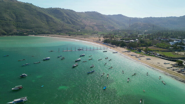 Drone perspective of Kuta Lombok coastline showing beach and clear ocean waters