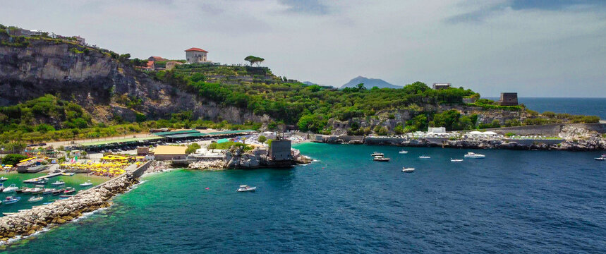 Panoramic aerial shot of Marina di Puolo coastline near