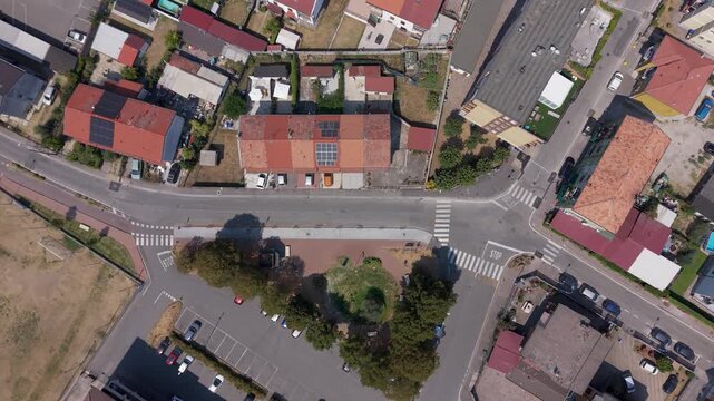 Top-down drone view of streets, houses and rooftops in Mediglia near Milan, capturing the residential landscape and everyday suburban character of Lombardy.