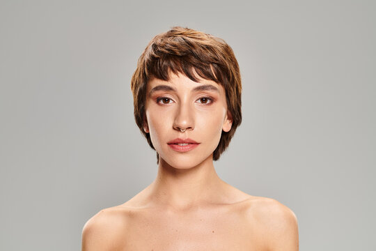 Captivating beauty portrait of a young woman with radiant skin and unique style