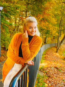 Attractive woman walking in autumn park