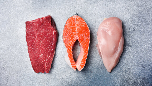 Beef meat, salmon fish and chicken meat. A set of steaks and meat. Top view. Raw food.