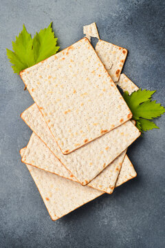 Matzoh jewish holiday bread. Traditional ritual Jewish bread. Top view, on a gray background.