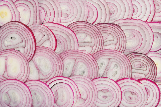 Red onion rings sliced texture background, Group of chopped onion top view