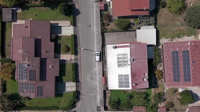 Top-down drone view of streets, houses and rooftops in Mediglia near Milan, capturing the residential landscape and everyday suburban character of Lombardy.