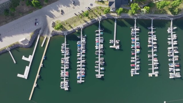 Aerial view of Lucky Peak Lake marina with rows of boats docked at piers along the shoreline in Ada County, Idaho, United States.