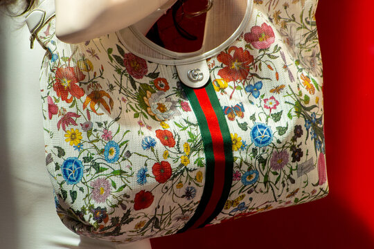 Gucci Luxury Floral Handbag on Display in Boutique Window. Milan, Italy - June 24, 2026
