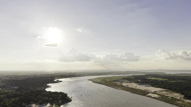 Wide aerial view of two major rivers, the Gorai and Padma, surrounded by green agricultural land, vegetation, and rural communities in Kushtia, Bangladesh.