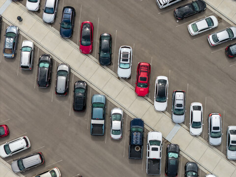 Aerial view of cars parked in rows in an outdoor parking lot in Eagle Mountain, Utah, United States.