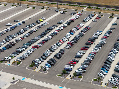 Aerial view of cars parked in rows in an outdoor parking lot in Eagle Mountain, Utah, United States.