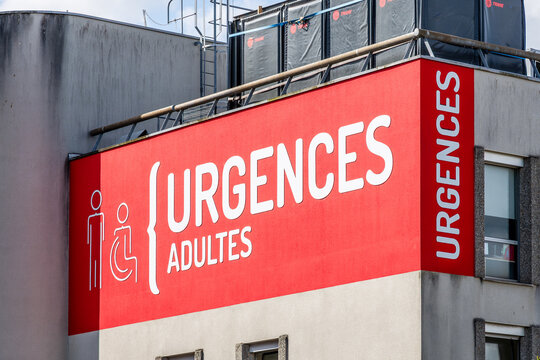 Cherbourg, France - July 20, 2026: Close-up view of the large adult emergency service sign at the entrance of the Louis Pasteur Hospital, part of the Cotentin Public Hospital Center, on a sunny day.