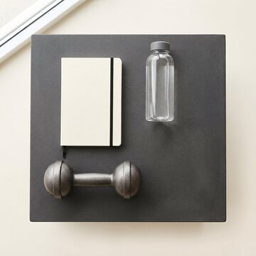 Home Fitness Equipment and Planning Notebook for Workout Routine, Healthy Lifestyle and Wellness Concept
