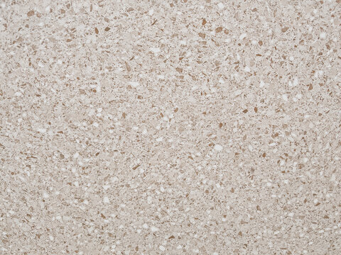 High-resolution commercial background featuring a beige terrazzo stone aggregate texture with speckled quartz and marble chips. Target audience includes interior designers, architectural visualizers, 