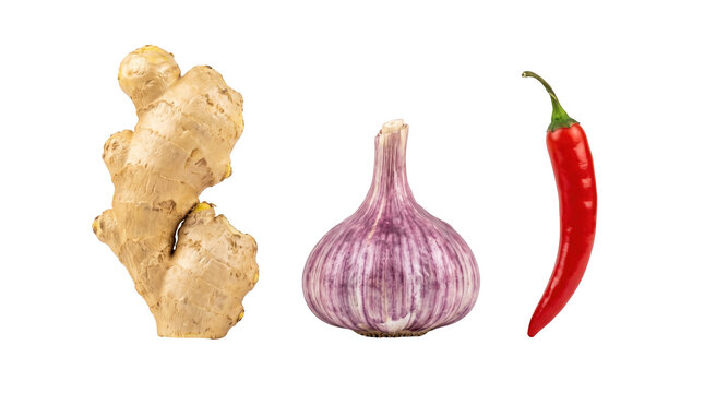 Fresh garlic, ginger root, and red chili pepper for spice background presentation