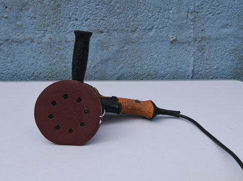 Orbital Sander on Wooden Surface &ndash; Power Tool for Woodworking and DIY