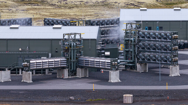 Aerial view of the Direct Air Capture and Storage Plant featuring industrial fans and modular decarbonization technology in a rugged landscape in Olfus, Sveitarfelagid Olfus, Iceland.