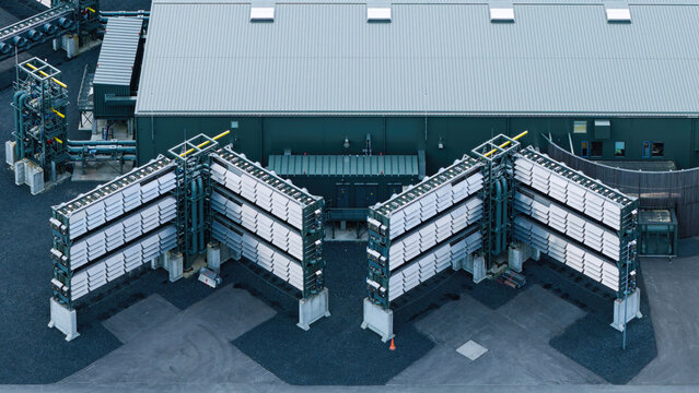 Aerial view of the Direct Air Capture and Storage Plant, a decarbonization facility featuring large carbon-capturing fan arrays and industrial infrastructure in Olfus, Sveitarfelagid Olfus, Iceland.