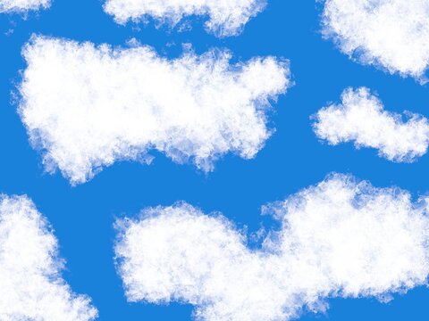 Blue and white background. Patches of thick white clouds in a blue sky.