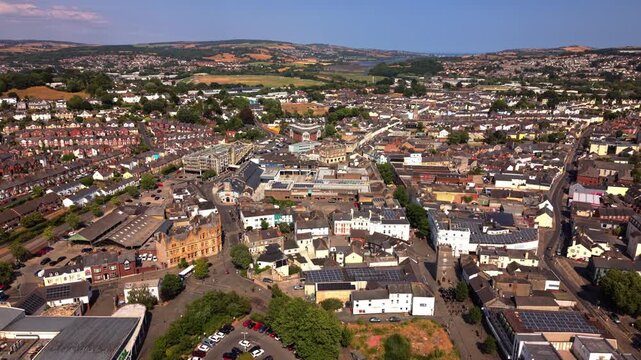An aerial drone panning across the old market town of Newton abbot in Devon, England. The racecourse and river reign can be seen in the distance.