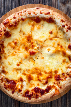 Pizza Bianca white pizza with oregano on wooden table. Top view
