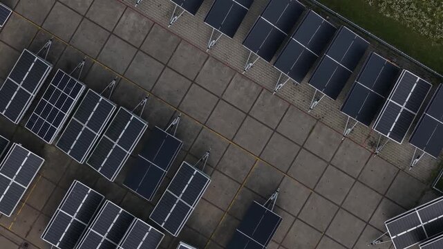 Aerial view of a mobile solar installation using photovoltaic panels to generate renewable electricity and charge batteries for off-grid energy storage.