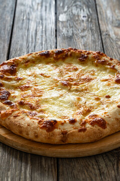 Pizza Bianca white pizza with oregano on wooden table

