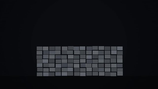 A wall made of gray rectangular bricks against a dark background