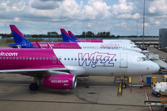 LUTON, UK - JULY 12, 2019: Wizz Air Airbus A320 fleet at London Luton Airport in the UK. It is UK's 5th busiest airport with 16.5 million annual passengers.