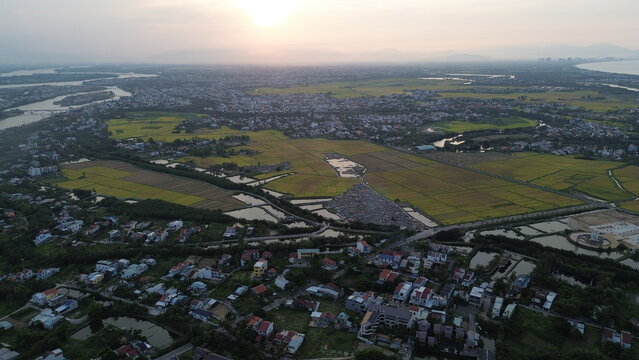 High altitude aerial view of Hoi An city and winding river tributaries in Thu Bon river delta, Vietnam