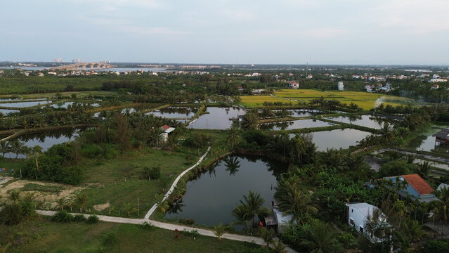 High altitude aerial view of Hoi An city and winding river tributaries in Thu Bon river delta, Vietnam