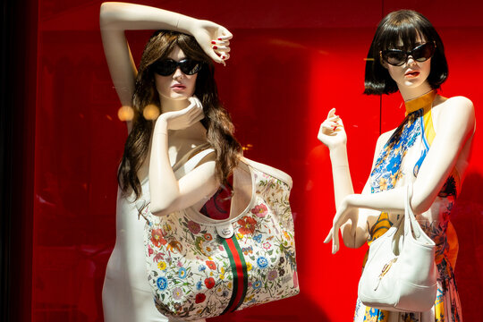 Mannequins bag Gucci Luxury Floral Handbag on Display in Boutique Window. Milan, Italy - June 24, 2026