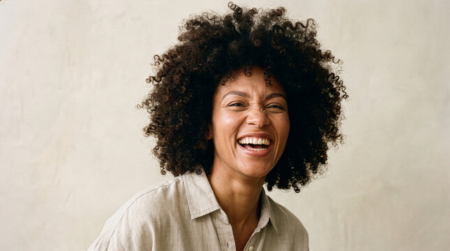 Candid Portrait of Laughing Woman with Natural Curly Hair