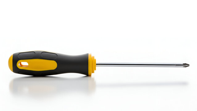 Professional phillips head screwdriver with black and yellow handle on white reflective surface for hardware repair work.
