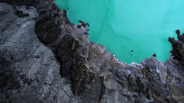 Turquoise Crater Lake at Mount Ijen Volcano Seen from Above